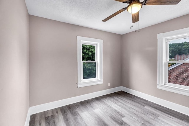 26 Olivine St, Chicopee, MA 01013 - empty room featuring ceiling fan, wood finished floors, and a textured ceiling