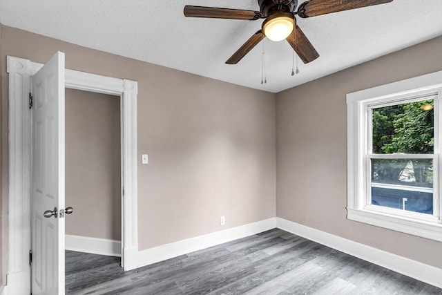 26 Olivine St, Chicopee, MA 01013 - unfurnished room with dark wood-style floors, ceiling fan, and a textured ceiling