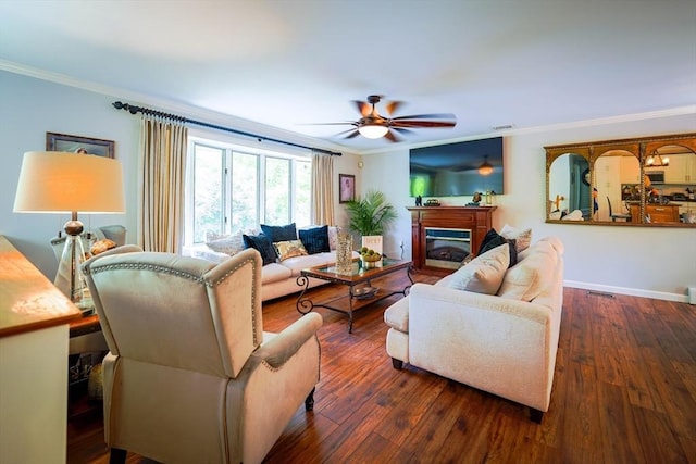 597 Fisher Rd, Dartmouth, MA 02747 - living room featuring ornamental molding, a ceiling fan, hardwood / wood-style floors, a glass covered fireplace, and baseboards