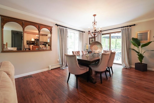 597 Fisher Rd, Dartmouth, MA 02747 - dining area featuring baseboard heating, a chandelier, crown molding, dark wood-type flooring, and baseboards