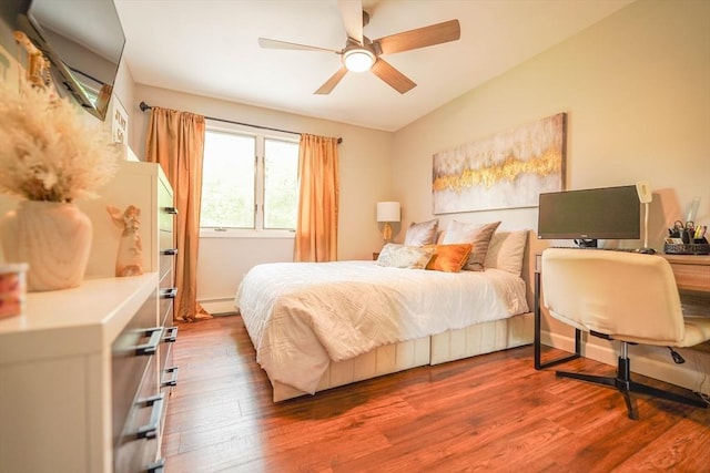 597 Fisher Rd, Dartmouth, MA 02747 - bedroom featuring wood finished floors, a ceiling fan, and a baseboard heating unit
