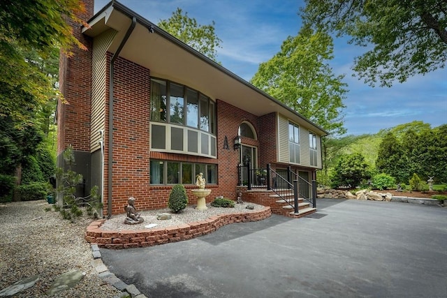 597 Fisher Rd, Dartmouth, MA 02747 - exterior space with a chimney and brick siding