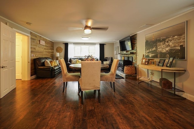 597 Fisher Rd, Dartmouth, MA 02747 - dining area featuring crown molding, a fireplace, wood finished floors, and ceiling fan