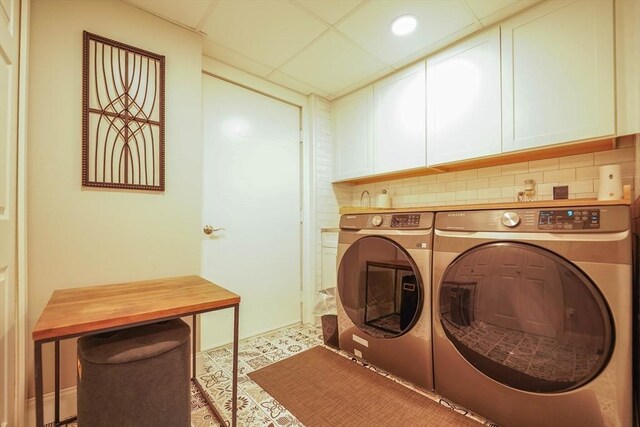 597 Fisher Rd, Dartmouth, MA 02747 - laundry room featuring cabinet space and separate washer and dryer