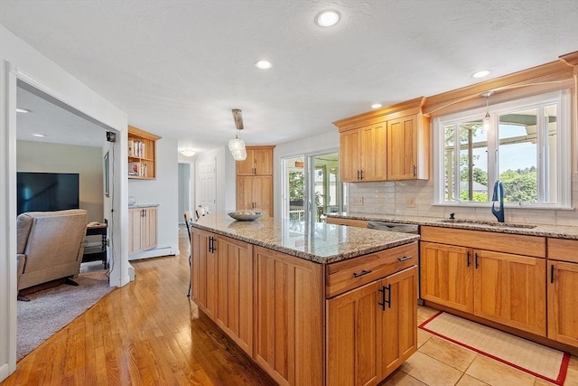 3 Sycamore Dr, Rutland, MA 01543 - kitchen featuring a kitchen island, backsplash, light stone counters, pendant lighting, and recessed lighting