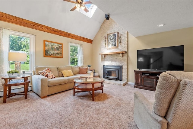 3 Sycamore Dr, Rutland, MA 01543 - living area featuring carpet, a baseboard heating unit, a ceiling fan, a fireplace, and a skylight