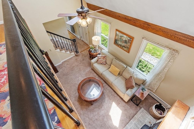 3 Sycamore Dr, Rutland, MA 01543 - living area featuring ceiling fan, stairway, carpet flooring, and a baseboard radiator