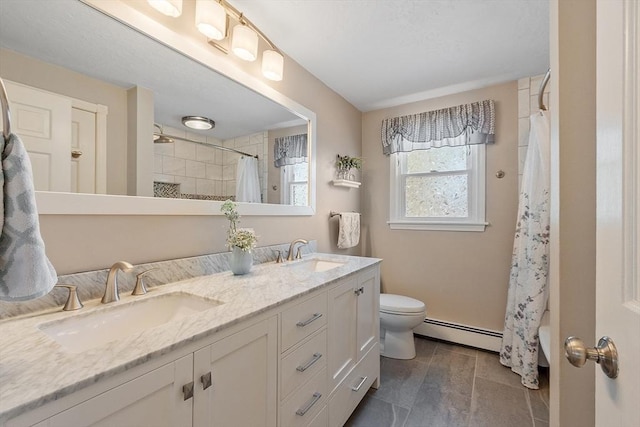 3 Sycamore Dr, Rutland, MA 01543 - bathroom featuring a baseboard heating unit and double vanity