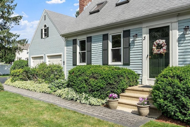 3 Sycamore Dr, Rutland, MA 01543 - view of home's exterior with a chimney, a garage, and a shingled roof
