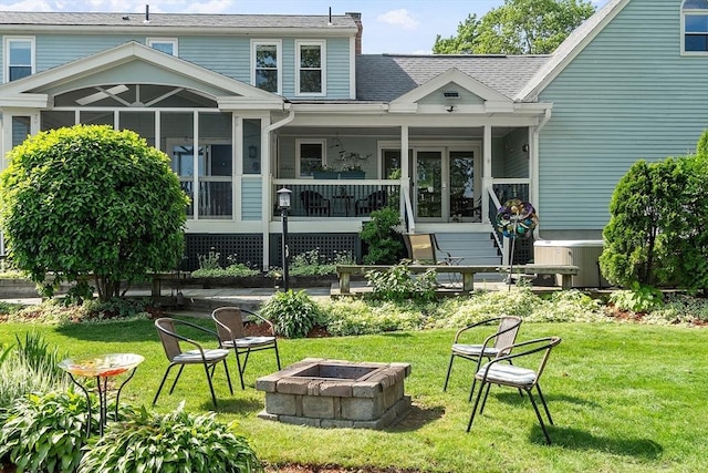 3 Sycamore Dr, Rutland, MA 01543 - back of property featuring a fire pit, a lawn, and a shingled roof