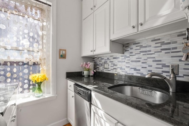 15 University Unit 32, Brookline, MA 02445 - kitchen with stainless steel dishwasher, decorative backsplash, white cabinets, and dark stone countertops