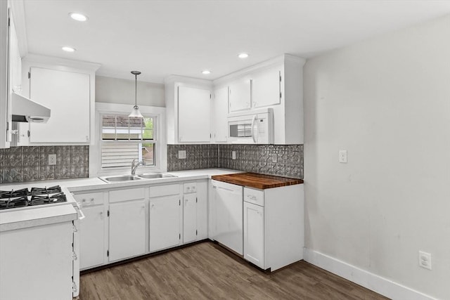 5 London Rd, Salem, NH 03079 - kitchen with a sink, white appliances, under cabinet range hood, dark wood-style flooring, and backsplash