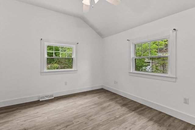 5 London Rd, Salem, NH 03079 - unfurnished room featuring plenty of natural light, lofted ceiling, wood finished floors, ceiling fan, and baseboards