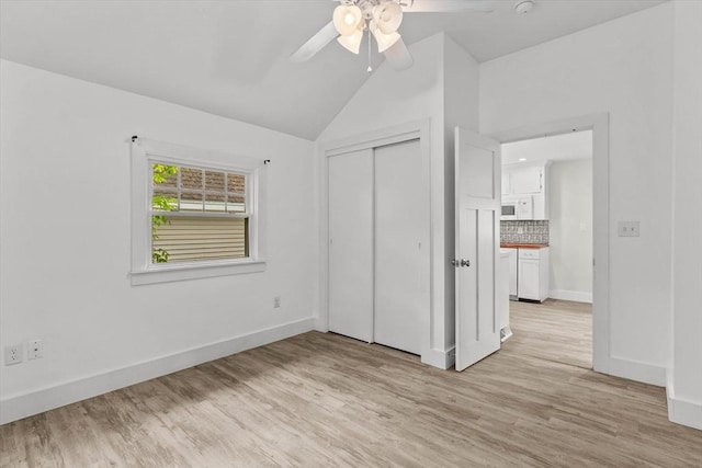 5 London Rd, Salem, NH 03079 - unfurnished bedroom with vaulted ceiling, light wood finished floors, baseboards, a closet, and ceiling fan