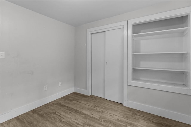 5 London Rd, Salem, NH 03079 - unfurnished bedroom featuring wood finished floors, a closet, and baseboards