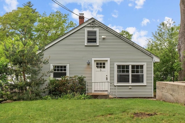 5 London Rd, Salem, NH 03079 - back of house with a chimney and a yard