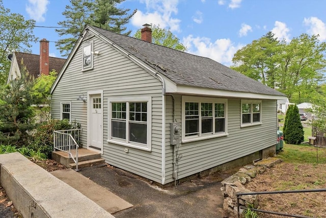 5 London Rd, Salem, NH 03079 - view of front of house with roof with shingles and a chimney