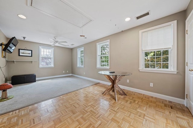 interior space with baseboards, visible vents, attic access, and recessed lighting