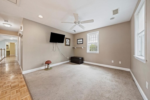 carpeted empty room with visible vents, ceiling fan, recessed lighting, and baseboards