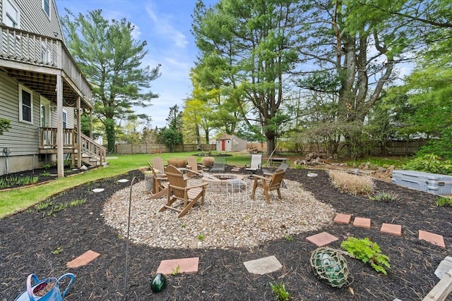 view of patio / terrace with a fenced backyard and an outdoor fire pit