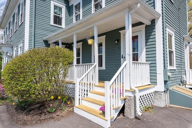 doorway to property featuring covered porch