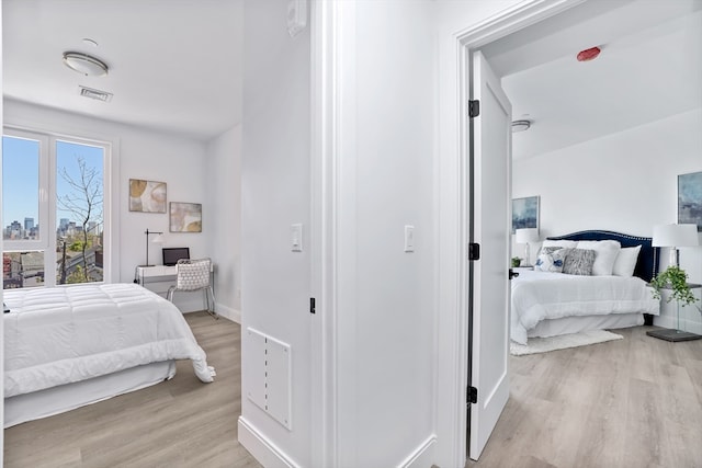 bedroom featuring light wood-type flooring