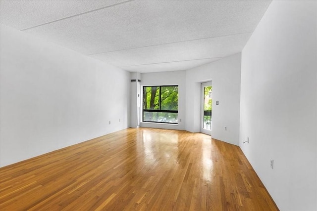 14 Heron St Unit 209, Boston, MA 02132 - unfurnished room featuring wood finished floors and a textured ceiling