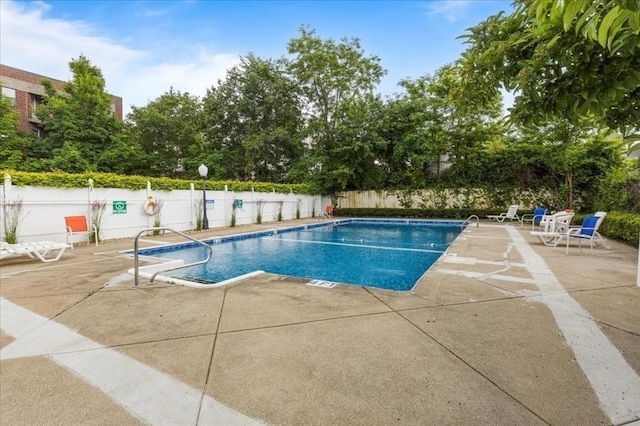 14 Heron St Unit 209, Boston, MA 02132 - community pool with a patio area and a fenced backyard