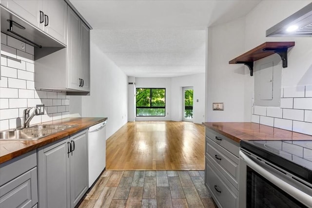 14 Heron St Unit 209, Boston, MA 02132 - kitchen featuring open shelves, butcher block counters, gray cabinetry, and dishwasher