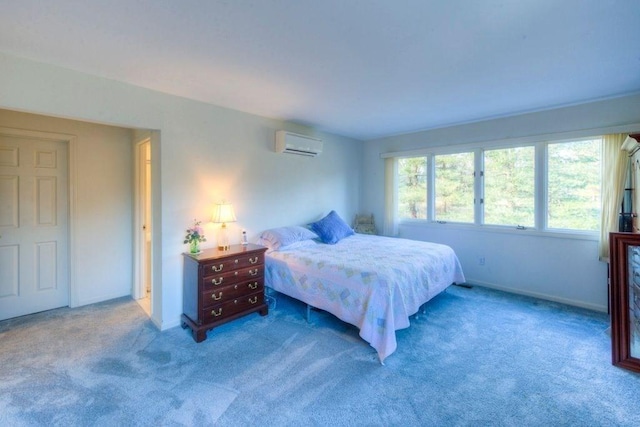 bedroom featuring light carpet and a wall mounted AC