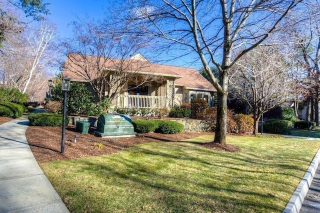 view of front of home with a front lawn and central AC unit