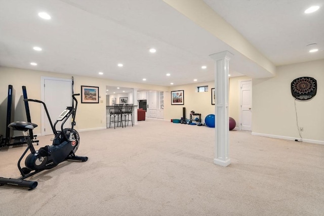 exercise room featuring light colored carpet