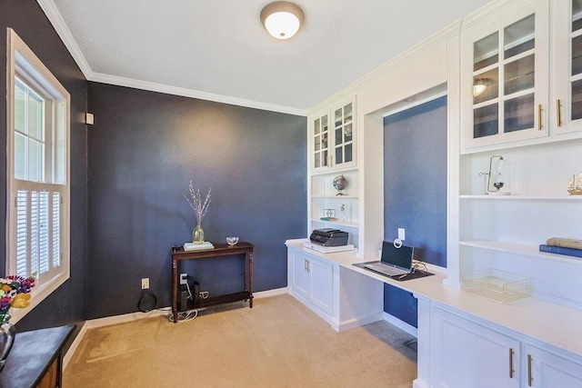 office area featuring baseboards, ornamental molding, built in features, and light carpet