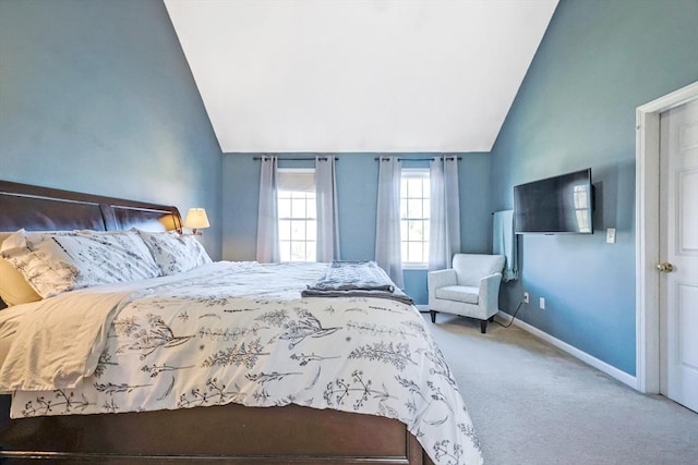 bedroom featuring carpet flooring, baseboards, and vaulted ceiling