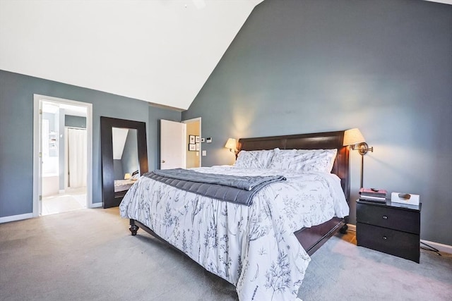 carpeted bedroom with high vaulted ceiling and baseboards