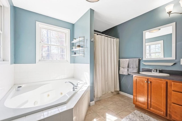bathroom featuring tile patterned floors, a whirlpool tub, vanity, and curtained shower