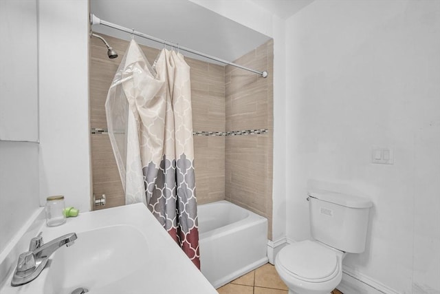 full bathroom featuring shower / tub combo with curtain, sink, tile patterned flooring, and toilet