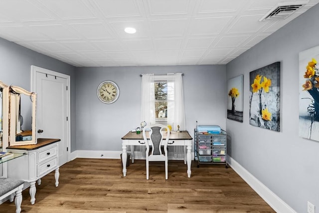 home office with wood-type flooring