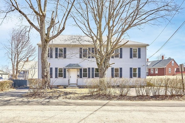 colonial house with fence