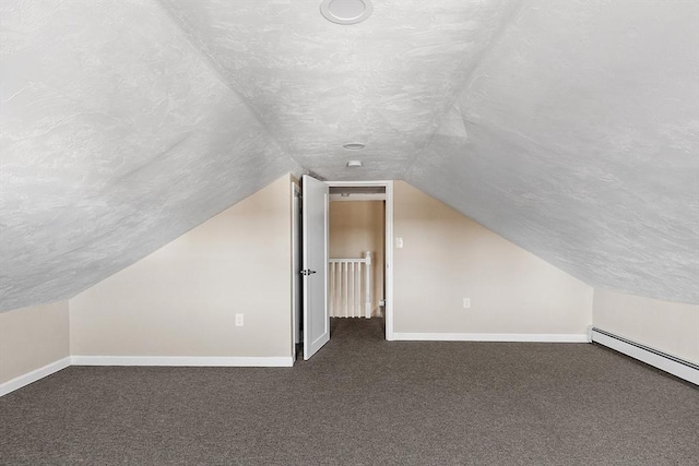 bonus room with baseboards, carpet floors, and a textured ceiling