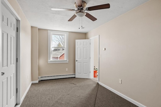 unfurnished bedroom with a ceiling fan, baseboards, a baseboard radiator, a textured ceiling, and carpet flooring