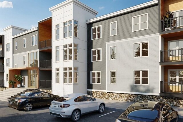 90 E Central St Unit 103, Franklin, MA 02038 - view of apartment building / complex with uncovered parking