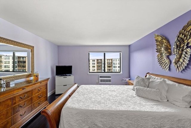 131 Coolidge Ave Unit 621, Watertown, MA 02472 - bedroom with wood finished floors and an AC wall unit