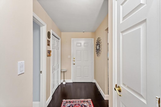 131 Coolidge Ave Unit 621, Watertown, MA 02472 - doorway featuring dark wood finished floors and baseboards