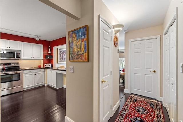 131 Coolidge Ave Unit 621, Watertown, MA 02472 - corridor with dark wood-type flooring and baseboards
