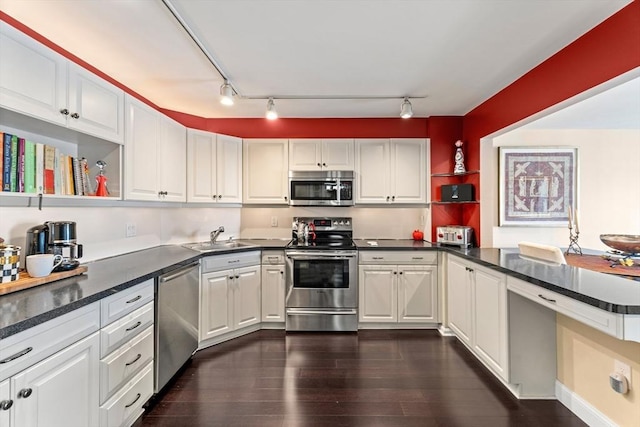 131 Coolidge Ave Unit 621, Watertown, MA 02472 - kitchen with appliances with stainless steel finishes, open shelves, dark wood-type flooring, white cabinets, and dark countertops