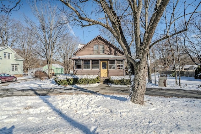 view of front facade with a sunroom