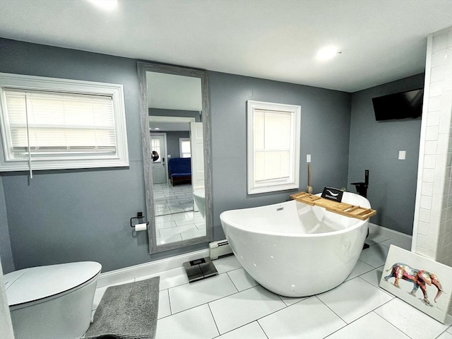 27 Overlook Rd, Holbrook, MA 02343 - full bathroom with a freestanding tub, a baseboard radiator, tile patterned flooring, baseboards, and toilet