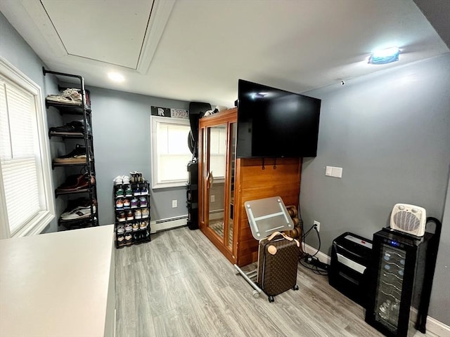 27 Overlook Rd, Holbrook, MA 02343 - interior space featuring a baseboard radiator, attic access, wood finished floors, and plenty of natural light