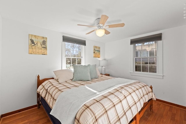 bedroom featuring hardwood / wood-style flooring and ceiling fan